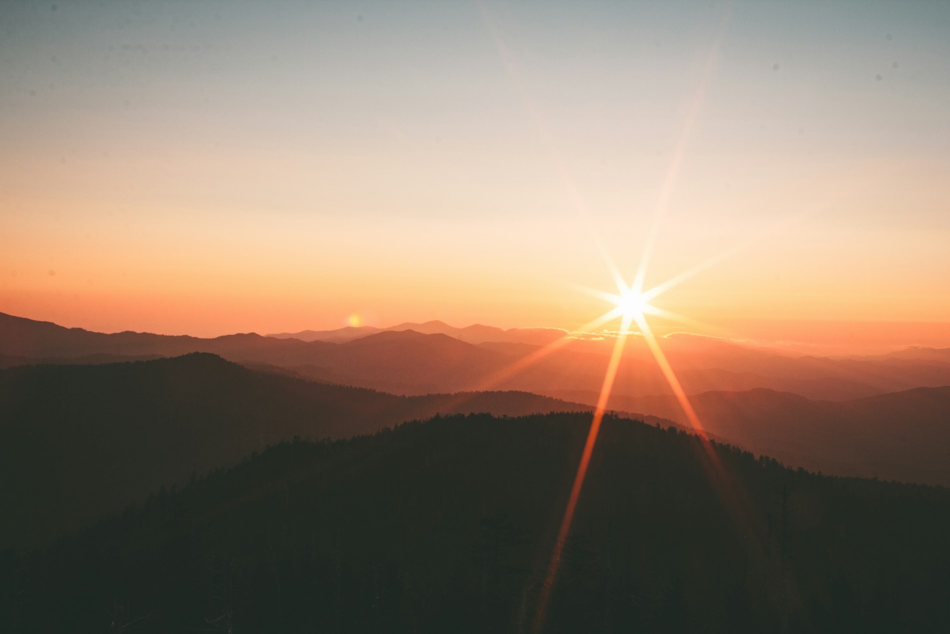 Sunrise over cottage-country hills